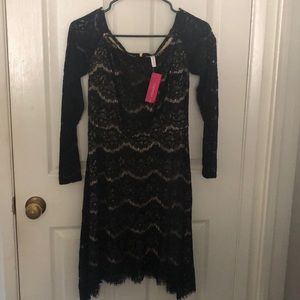 Black off the shoulder dress.